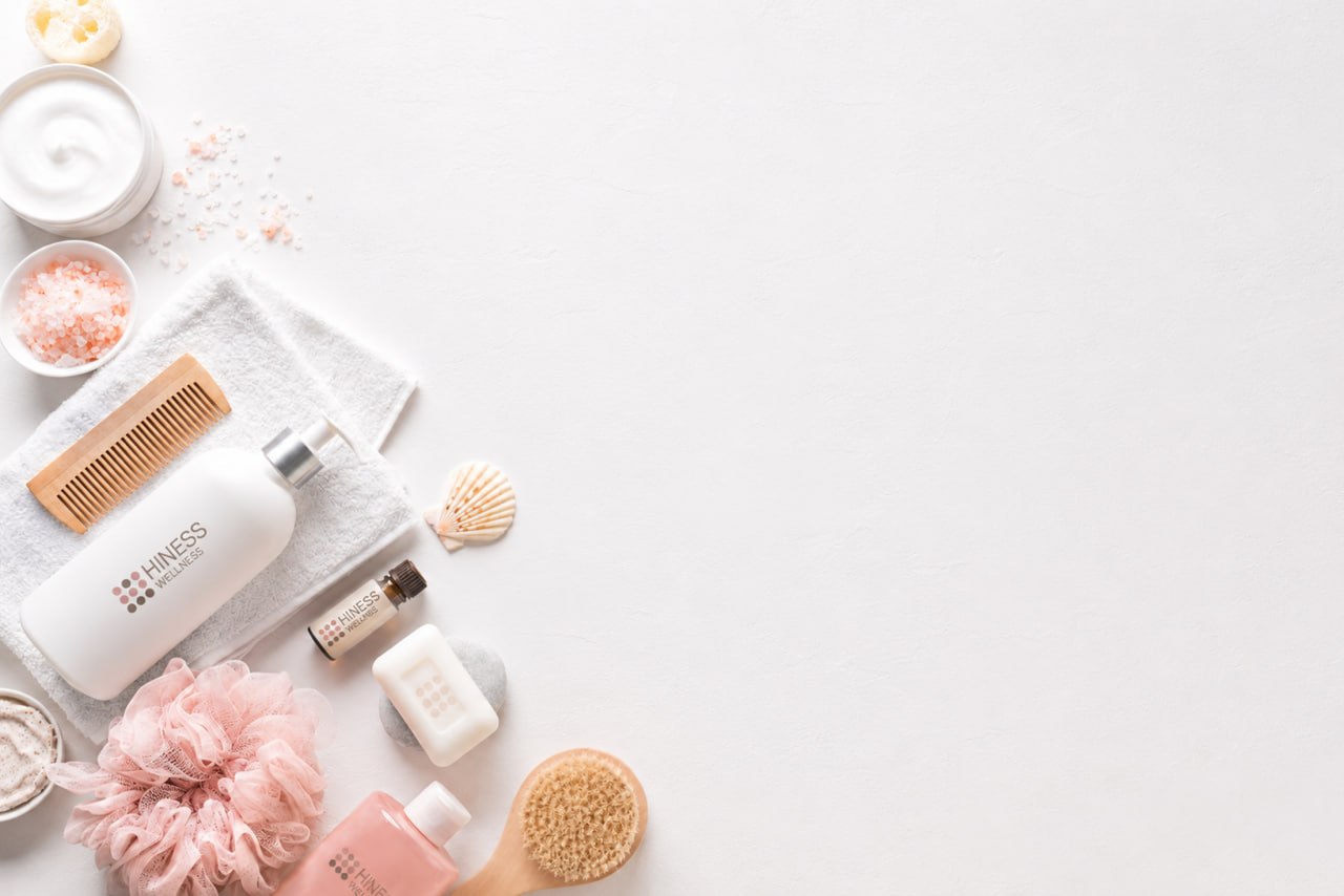 Beauty products arranged on a cream background