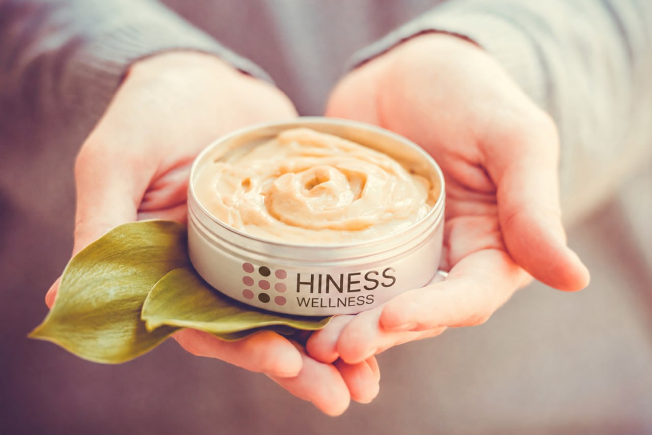 Cosmetic cream held in hands